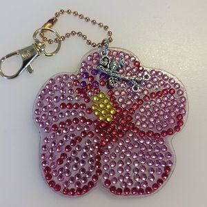 Flower keychain squirrel on a branch